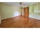 Bedroom with hardwood floors, built-in shelving, and closet space at 6205 Bramshaw Rd, Indianapolis, IN 46220