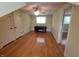 Bedroom with hardwood floors, ceiling fan, desk, and closet at 6205 Bramshaw Rd, Indianapolis, IN 46220