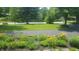 View of beautifully landscaped front yard at 6205 Bramshaw Rd, Indianapolis, IN 46220