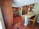 Beautiful kitchen with dark wood cabinets, stainless steel appliances and a breakfast bar with seating at 6205 Bramshaw Rd, Indianapolis, IN 46220