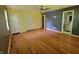 Main bedroom with hardwood floors, ceiling fan, and ensuite bathroom featuring a vanity at 6205 Bramshaw Rd, Indianapolis, IN 46220