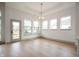 Spacious dining area with hardwood floors and large windows at 15786 Vitalize Run, Fishers, IN 46040