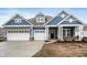 Two-story home with blue siding, white trim, and a three-car garage at 15786 Vitalize Run, Fishers, IN 46040