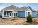 Rear view of a charming blue house with a spacious backyard at 15786 Vitalize Run, Fishers, IN 46040