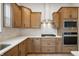 Well-equipped kitchen featuring stainless steel appliances and light wood cabinetry at 15786 Vitalize Run, Fishers, IN 46040