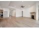 Open living room with hardwood floors, a fireplace, and access to the backyard at 15786 Vitalize Run, Fishers, IN 46040