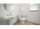 Convenient powder room with pedestal sink and stylish tile floor at 15786 Vitalize Run, Fishers, IN 46040
