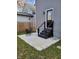 Back patio featuring outdoor seating and black stairs leading to the door, complemented by gray siding and a wooden fence at 2828 Robson St, Indianapolis, IN 46201