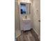 Bathroom featuring a modern sink, mirror, and partial view of glass shower at 2828 Robson St, Indianapolis, IN 46201