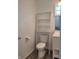 Updated bathroom with a toilet, vanity, and decorative shelving for storage at 2828 Robson St, Indianapolis, IN 46201