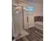 Modern bathroom showcasing a glass shower enclosure and tiled accent wall above the tub at 2828 Robson St, Indianapolis, IN 46201