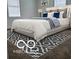Comfortable bedroom featuring a large bed, neutral-colored walls, and natural light at 2828 Robson St, Indianapolis, IN 46201
