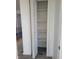Hall closet with wood shelving and paint in neutral colors at 2828 Robson St, Indianapolis, IN 46201