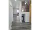 Hallway view leading to living area with staircase and ample natural light at 2828 Robson St, Indianapolis, IN 46201