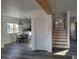Bright living room featuring wood-look floors, staircase, and contemporary decor at 2828 Robson St, Indianapolis, IN 46201