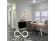 Bright office space with modern desk, art, and natural light from a window at 2828 Robson St, Indianapolis, IN 46201
