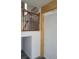 View of staircase with wrought iron railing and wood accents at 2828 Robson St, Indianapolis, IN 46201