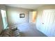 Bedroom with carpeted floor, window, and adjacent hallway view at 5211 Nicodemus Dr, Plainfield, IN 46168
