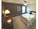 Bedroom with carpeted floor, ceiling fan, and dark brown accent wall at 5211 Nicodemus Dr, Plainfield, IN 46168