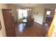 Formal dining room with hardwood floors, chandelier, and view to kitchen at 5211 Nicodemus Dr, Plainfield, IN 46168
