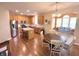 An open-concept kitchen flows into the dining and sunroom areas, ideal for entertaining and everyday living at 5211 Nicodemus Dr, Plainfield, IN 46168