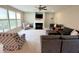Bright living room with a fireplace, comfortable seating, and large windows, creating a welcoming atmosphere at 5211 Nicodemus Dr, Plainfield, IN 46168