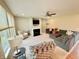 Inviting living room with a cozy fireplace, ample seating, and large windows that let in natural light at 5211 Nicodemus Dr, Plainfield, IN 46168