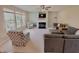 Spacious living room with a fireplace, comfortable seating, and plenty of natural light streaming through the windows at 5211 Nicodemus Dr, Plainfield, IN 46168