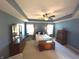 Main bedroom with carpeted floor, ceiling fan, and ample furniture space at 5211 Nicodemus Dr, Plainfield, IN 46168