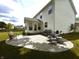 A beautifully stamped concrete patio with outdoor seating, perfect for enjoying warm days and entertaining guests at 5211 Nicodemus Dr, Plainfield, IN 46168