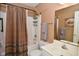 Neutral bathroom featuring a shower-tub combo, single sink vanity, and matching wall paint at 1612 S Jeanne Ct, New Palestine, IN 46163