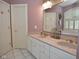 Bathroom featuring a double sink vanity and a large mirror at 1612 S Jeanne Ct, New Palestine, IN 46163