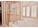 Bathroom with a shower, soaking tub, and shuttered window at 1612 S Jeanne Ct, New Palestine, IN 46163