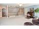 This bonus room features a railing, a vintage desk, and soft carpeting at 1612 S Jeanne Ct, New Palestine, IN 46163