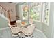 Charming breakfast nook with natural lighting and table, ideal for enjoying morning meals and gatherings at 1612 S Jeanne Ct, New Palestine, IN 46163