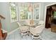 Charming breakfast nook with white table and chairs, a chandelier, and natural light at 1612 S Jeanne Ct, New Palestine, IN 46163