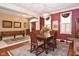 Elegant dining room featuring an entryway, wooden table, and decor at 1612 S Jeanne Ct, New Palestine, IN 46163