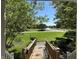 A charming view from the porch overlooking a verdant neighborhood street with mature trees and blue skies at 1612 S Jeanne Ct, New Palestine, IN 46163