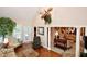 Living room featuring a high ceiling, large windows, and view of the formal living room at 1612 S Jeanne Ct, New Palestine, IN 46163