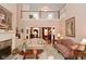 Bright living room featuring fireplace and an entryway to the dining room at 1612 S Jeanne Ct, New Palestine, IN 46163