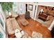 Living room featuring a high ceiling, large windows, and view of the formal living room at 1612 S Jeanne Ct, New Palestine, IN 46163