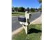 Mailbox with house number on a sunny day with manicured lawn and neighborhood street at 1612 S Jeanne Ct, New Palestine, IN 46163