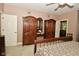 Spacious main bedroom featuring a bed and antique wardrobe, creating a cozy and timeless aesthetic at 1612 S Jeanne Ct, New Palestine, IN 46163