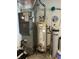 A furnace, water heater, and water softener stand together in a utility room at 1612 S Jeanne Ct, New Palestine, IN 46163
