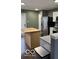 Modern kitchen with stainless steel appliances and butcher block island at 3033 Everbloom Way, Indianapolis, IN 46217