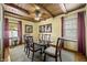 Dining room with dark wood table, seating for six, and bright natural light at 610 E Morgan St, Martinsville, IN 46151