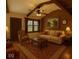 Cozy living room features paneled walls, a ceiling fan, stylish furniture, and warm lighting for a comfortable atmosphere at 610 E Morgan St, Martinsville, IN 46151