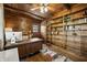 Wood-paneled office with built-in bookshelves, hardwood floors, and a large desk at 610 E Morgan St, Martinsville, IN 46151