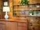Office space with wooden paneling, display shelves, a lamp, and a framed Indiana University diploma at 610 E Morgan St, Martinsville, IN 46151