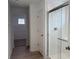 Bathroom with white tile shower, gray flooring, and linen closet at 15893 Tharp Woods Dr, Fishers, IN 46037